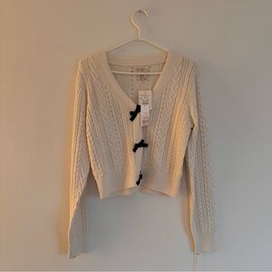 Elegant Cream Cable Knit Sweater with Black Bows